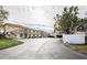 Two-story building with multiple units, balconies, parking and driveway at 6180 Sun Blvd # 204, St Petersburg, FL 33715