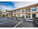 Condominium building exterior showcasing multiple units and parking at 6180 Sun Blvd # 204, St Petersburg, FL 33715