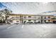 Two-story building with multiple units, balconies, and parking at 6180 Sun Blvd # 204, St Petersburg, FL 33715