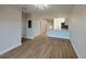 Bright living room with light wood flooring and kitchen at 10402 Pendleton Ave, Englewood, FL 34224