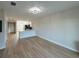 Bright living room with light wood flooring and kitchen at 10402 Pendleton Ave, Englewood, FL 34224