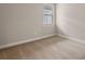 Simple bedroom with neutral wall color, carpet flooring, and a window at 11170 Livewell Ct, Venice, FL 34293