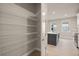 Walk-in pantry with wire shelving offering ample storage space at 11170 Livewell Ct, Venice, FL 34293