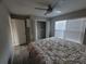 Bright bedroom with a queen bed, ceiling fan, and ample closet space at 3631 4Th N Ave, St Petersburg, FL 33713