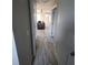 Clean hallway with light gray walls and tiled floor at 3631 4Th N Ave, St Petersburg, FL 33713