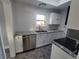 Updated kitchen features granite countertops, stainless steel appliances, and white shaker cabinets at 3631 4Th N Ave, St Petersburg, FL 33713