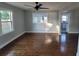 Living room features hardwood floors and a view of the kitchen at 3631 4Th N Ave, St Petersburg, FL 33713