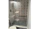 Updated shower with patterned tile and glass enclosure at 3631 4Th N Ave, St Petersburg, FL 33713