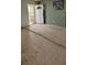 Renovation project entryway with new flooring and a white door at 4780 Butterfly Ne Pl, St Petersburg, FL 33703