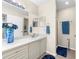 Bathroom featuring a single sink, white cabinetry, and a glass door shower at 9481 Highland Oak Dr # 512, Tampa, FL 33647