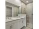 Modern bathroom with double vanity, quartz countertop and a large walk-in shower at 11277 Boundless Ter, Venice, FL 34293