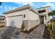 Modern house exterior with gray stone accents and a paved walkway at 11294 Boundless Ter, Venice, FL 34293