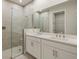 Modern bathroom with double vanity, large shower, and separate tub at 11267 Boundless Ter, Venice, FL 34293