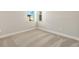 Bright bedroom with neutral walls and carpet flooring at 11267 Boundless Ter, Venice, FL 34293
