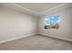 Spacious bedroom with carpeting and a large window with a water view at 11267 Boundless Ter, Venice, FL 34293