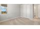 Bedroom with carpet flooring and double door closet at 11267 Boundless Ter, Venice, FL 34293