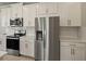 Sleek kitchen showcasing stainless steel appliances and white cabinetry at 11267 Boundless Ter, Venice, FL 34293