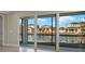 Screened-in patio overlooking a tranquil lake at 11267 Boundless Ter, Venice, FL 34293