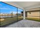 Screened porch with paver patio and lake view at 11267 Boundless Ter, Venice, FL 34293
