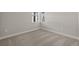 Simple bedroom with neutral gray walls and carpet flooring at 11275 Boundless Ter, Venice, FL 34293