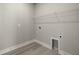 Laundry room with wire shelving and gray walls at 11275 Boundless Ter, Venice, FL 34293