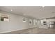 Spacious living room with gray walls, wood-look floors, and an open floor plan at 11275 Boundless Ter, Venice, FL 34293