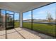 Spacious screened patio with paver floor and lake view at 11275 Boundless Ter, Venice, FL 34293