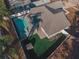 Aerial view of house with pool and landscaped backyard at 1533 Rolling Meadow Dr, Valrico, FL 33594