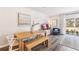 Combination living and dining area with light wood floors and contemporary decor at 4653 Pleasant Ave, Palm Harbor, FL 34683