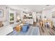 Open-concept living space with kitchen, dining, and living areas at 4653 Pleasant Ave, Palm Harbor, FL 34683