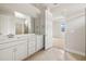 Bathroom featuring double sink vanity, quartz countertop and tile flooring at 17909 Solstice Ave, Venice, FL 34293