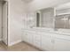 Bathroom featuring double sink vanity, quartz countertop and tile flooring at 17909 Solstice Ave, Venice, FL 34293