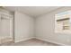 Bedroom with neutral paint, carpet, trim and window at 17909 Solstice Ave, Venice, FL 34293