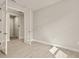 Bedroom featuring a large glass paneled double door and wood-look tile flooring at 17909 Solstice Ave, Venice, FL 34293