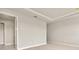 Bedroom with tray ceiling featuring neutral paint, carpet and trim at 17909 Solstice Ave, Venice, FL 34293