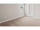 Bright bedroom with a window and neutral carpet flooring, offering a cozy and inviting space at 17909 Solstice Ave, Venice, FL 34293