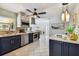 Modern kitchen with stainless steel appliances and a center island at 936 79Th S St, St Petersburg, FL 33707