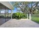 Spacious stone patio featuring an outdoor space with a view of the serene landscaping at 16407 Zurraquin De Avila, Tampa, FL 33613