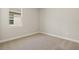 Cozy bedroom with neutral carpet, painted walls and bright window at 17938 Solstice Ave, Venice, FL 34293