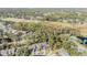 Aerial view showing home, community, and surrounding landscape at 215 Woods Landing Trl, Oldsmar, FL 34677