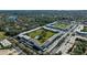 Aerial view of community highlighting the buildings, landscaping, and pool area at 4915 Bay Ne St # 123, St Petersburg, FL 33703