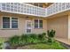 Condo building entrance with landscaping and access to unit at 4915 Bay Ne St # 123, St Petersburg, FL 33703