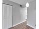 Simple dining area with light grey walls and wood-look floors at 4915 Bay Ne St # 123, St Petersburg, FL 33703