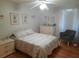 Bedroom with wood floors and plenty of natural light at 11708 Rolling Oaks Ln, Tampa, FL 33618