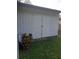 White storage shed in the backyard at 11708 Rolling Oaks Ln, Tampa, FL 33618