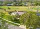 Bird's eye view of a house nestled in a lush, tree-lined golf course neighborhood at 435 Palmdale Dr, Oldsmar, FL 34677