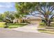 Single-story home with a brick paved driveway and lush green lawn at 435 Palmdale Dr, Oldsmar, FL 34677