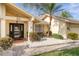 Welcoming front entry with a black door and stone pathway at 435 Palmdale Dr, Oldsmar, FL 34677