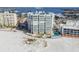 Aerial view of beachfront building and pool at 4950 Gulf Blvd # 206, St Pete Beach, FL 33706