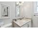 Simple bathroom with white vanity and marble countertop at 4950 Gulf Blvd # 206, St Pete Beach, FL 33706